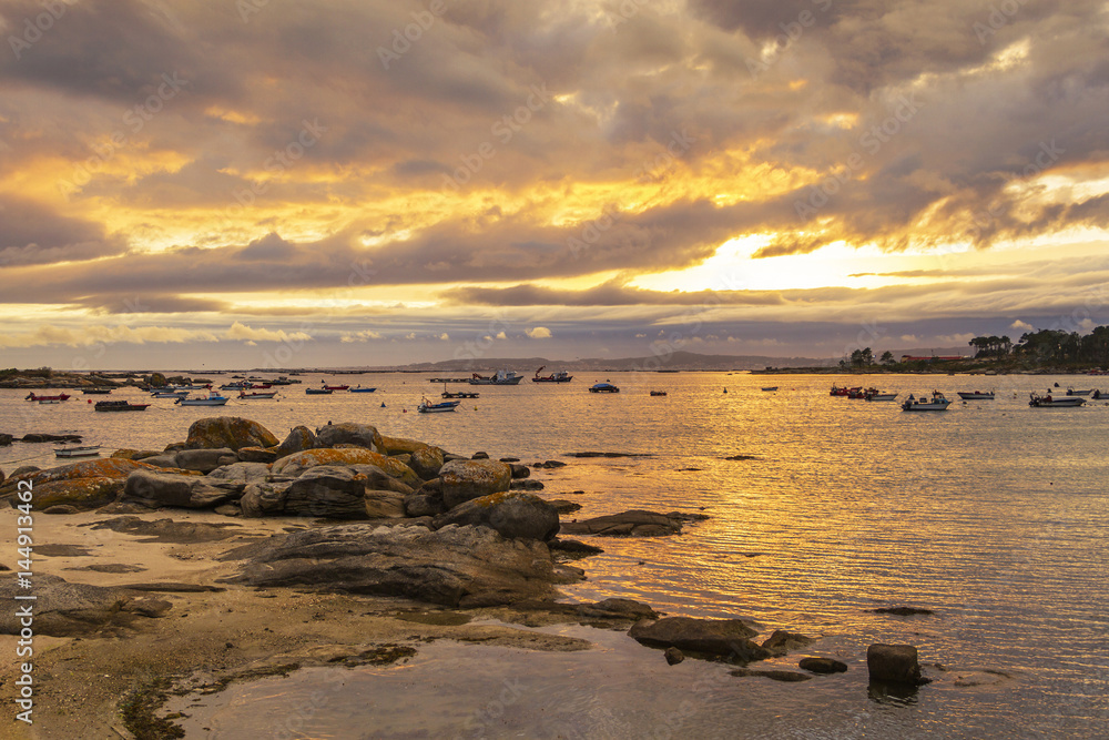 Cloudy sunset on Abilleira beach