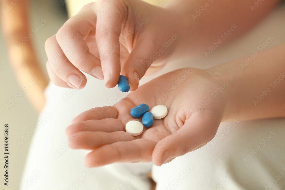 Hands of woman with pills, closeup Hands of woman with pills, closeup