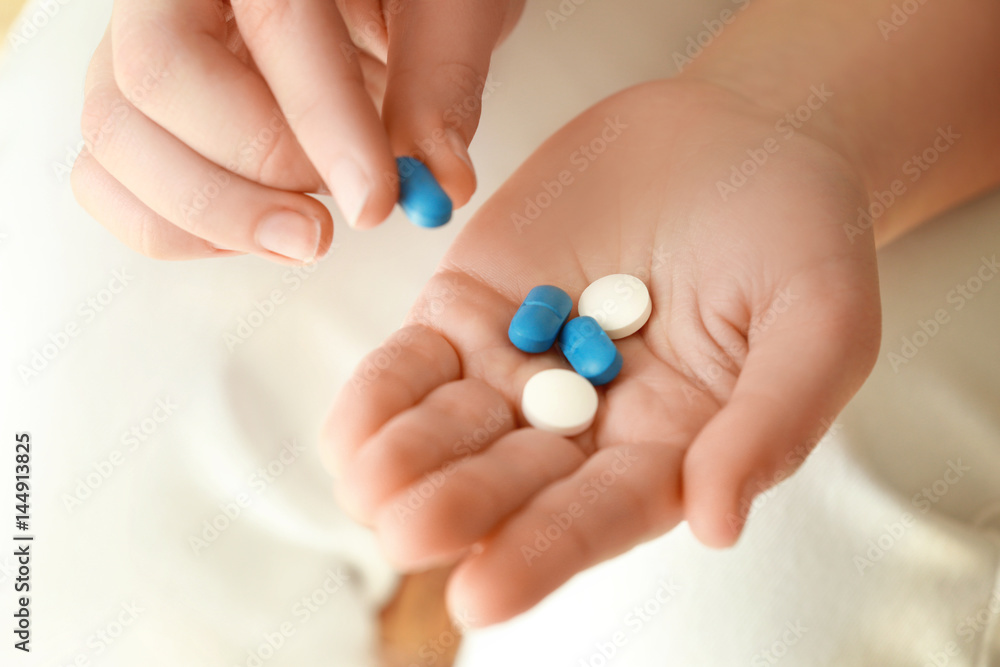 Hands of woman with pills, closeup Hands of woman with pills, closeup
