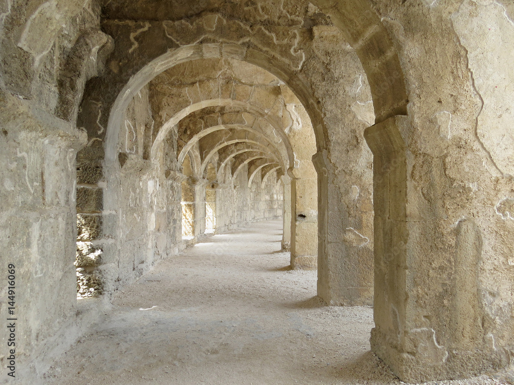 Arched gallery of the best-preserved theatre of antiquity in Aspendos, an ancient Greco-Roman city in Antalya province of Turkey.     