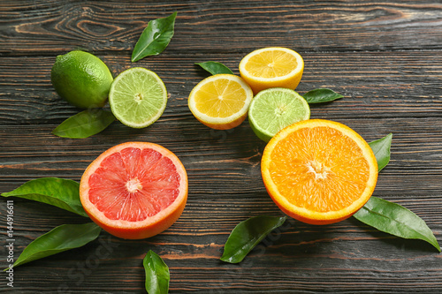 Fototapeta Naklejka Na Ścianę i Meble -  Beautiful composition of tropical fruits on wooden background