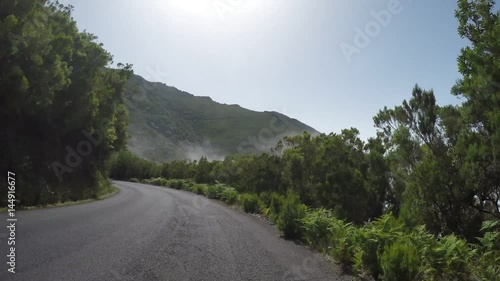 Driving on rural road in mountains with fog. PART 2 of 5. This real time video is also availabe a a timelapse video with all the 5 parts in one. Madeira, Portugal.  photo