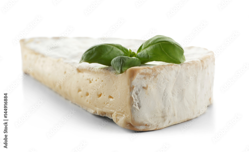 Tasty cheese and basil on white background, closeup