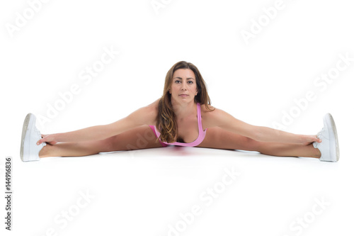 Healthy young fitness personal trainer woman warm up before sport training. Active lifestyle female isolated on white.