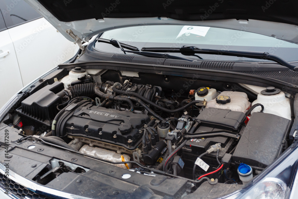 Fototapeta premium Car engine and parts under hood. Upgraded tuning ready for the diagnosis
