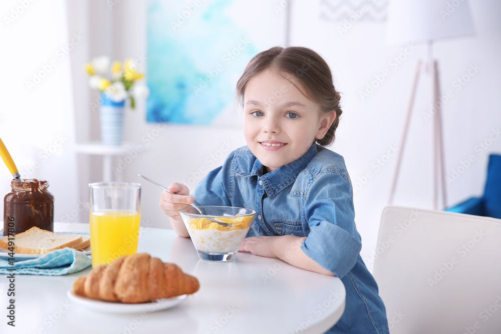 Cute little girl having breakfast at home Cute little girl having breakfast at home