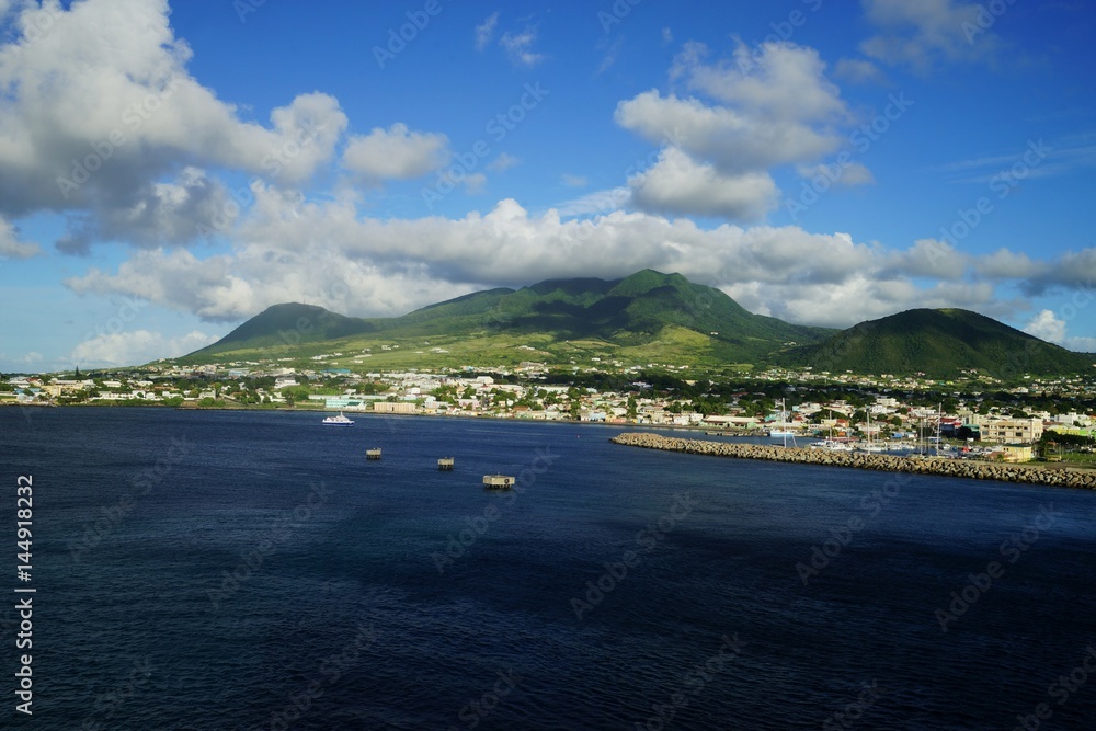Saint Kitts Island landscape -  view from water on a brignt sunny day with some white clouds