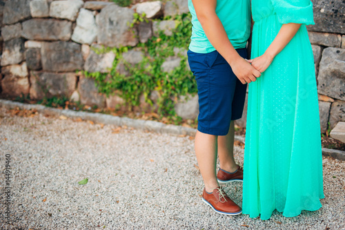 Female and male feet on the pavement. Wedding in Montenegro