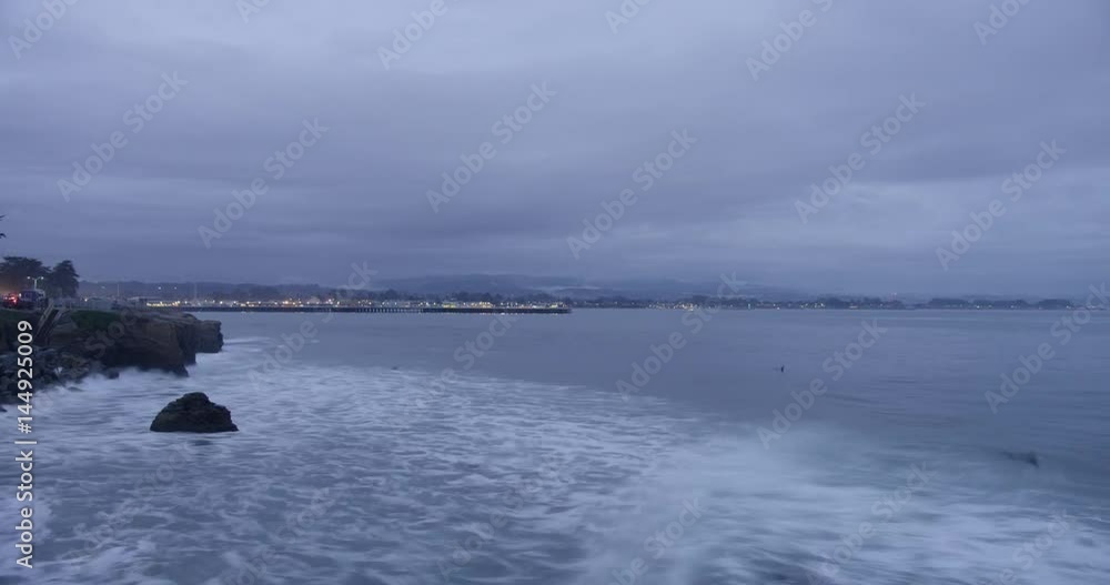 Time lapse of surfers at Lighthouse Field State Beach in Santa Cruz, California during sunset. Time lapse of surfers at Lighthouse Field State Beach in Santa Cruz, California during sunset.