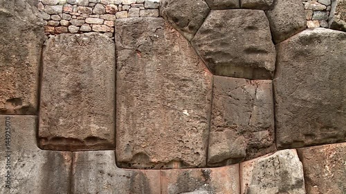 CLOSE UP: Stones in Inca wall in the Inka city Sacsayhuaman near Cusco in Peru.  photo