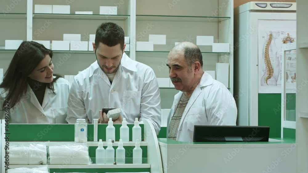 Smiling team of pharmacist at hospital pharmacy taking selfie Smiling team of pharmacist at hospital pharmacy taking selfie