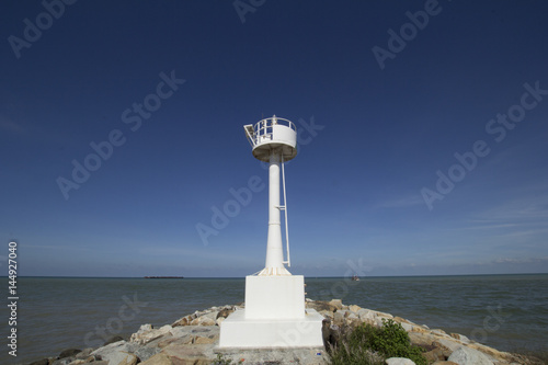 Lighthouse on the rock. During the day photo