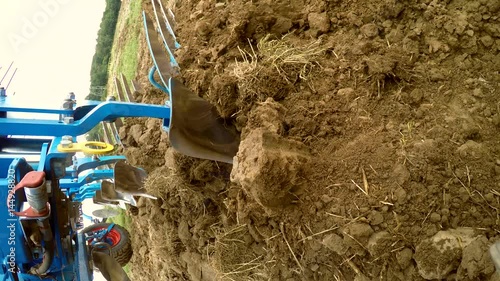 (  ) – on-board-camera on a plought of a tractor on a acre photo