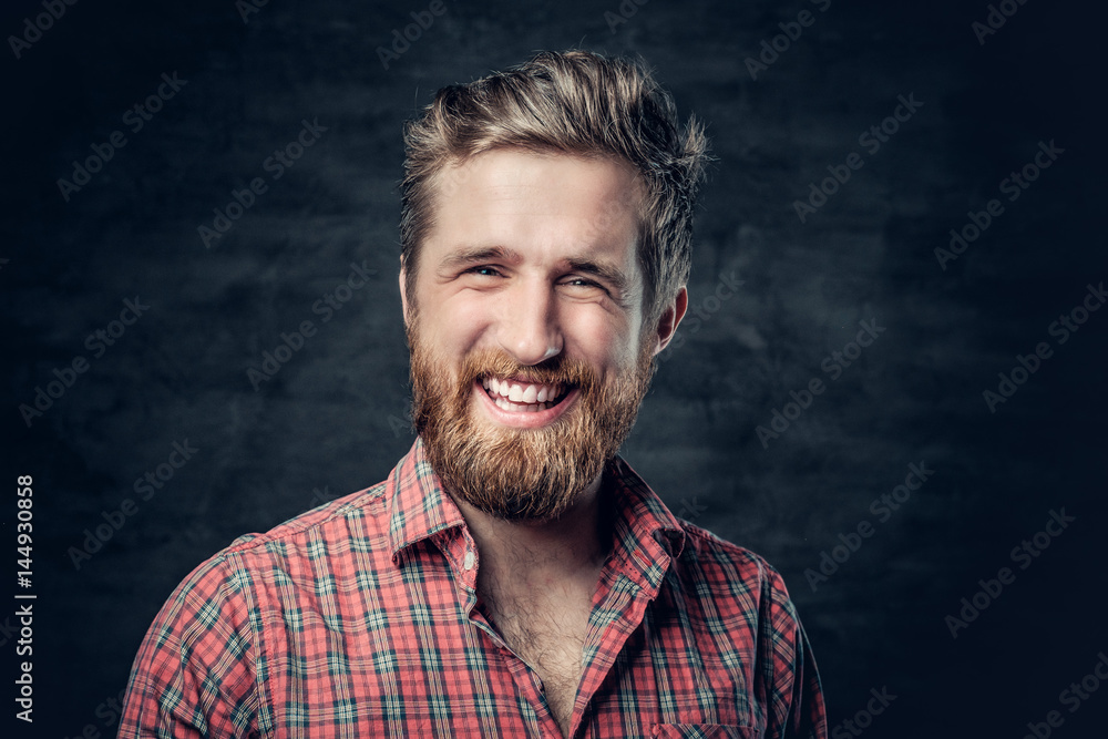 Bearded male dressed in a red fleece shirt makes conversation. Bearded male dressed in a red fleece shirt makes conversation.