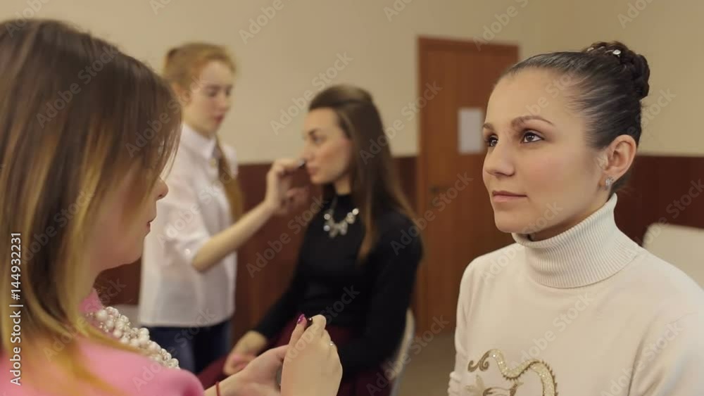 Makeup artists work with clients in the beauty salon. Makeup artists work with clients in the beauty salon.