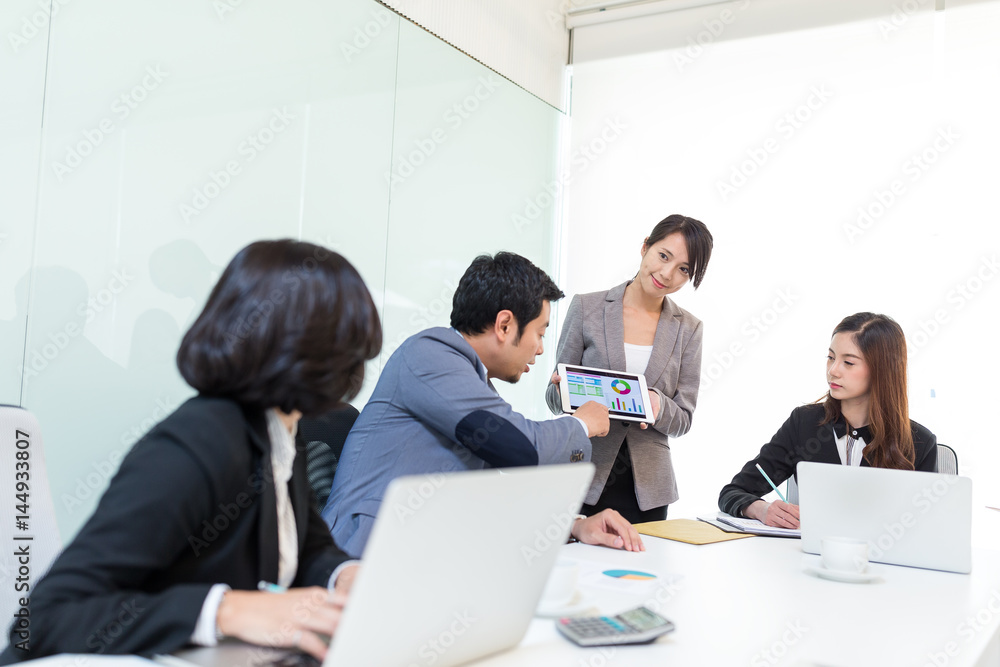Group of business people discuss in meeting room Group of business people discuss in meeting room