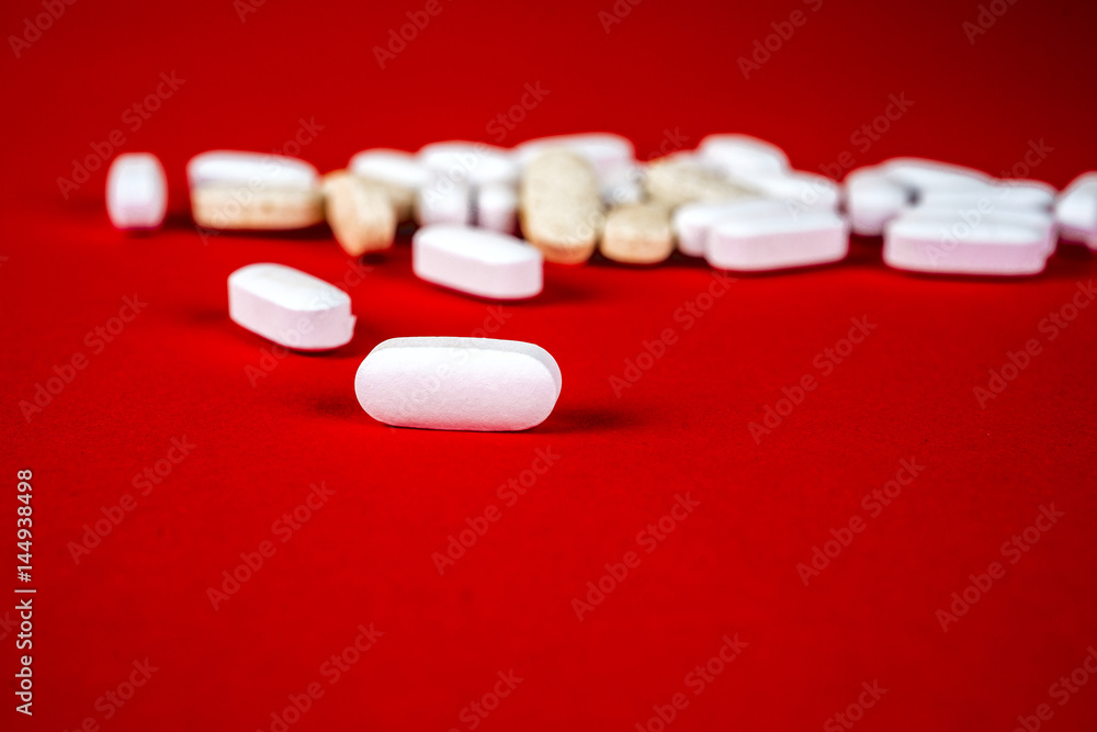 Pills ,tablets and stethoscope on white background Pills ,tablets and stethoscope on white background