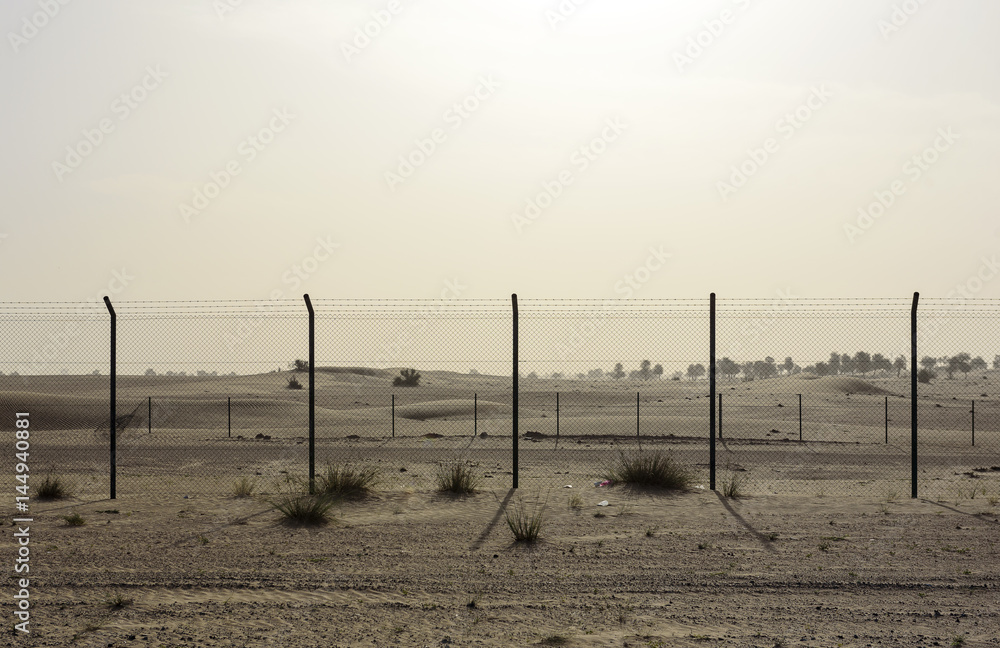 Fence in The Sand Desert at Sunny Day Fence in The Sand Desert at Sunny Day