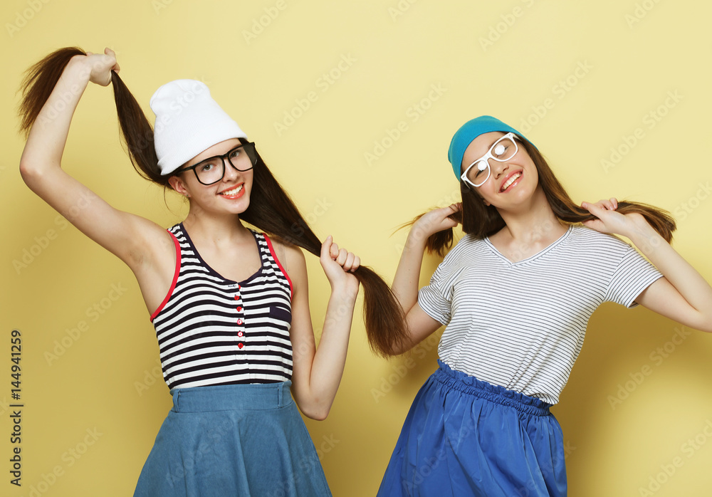 lifestyle and people concept: Two girl friends standing together lifestyle and people concept: Two girl friends standing together
