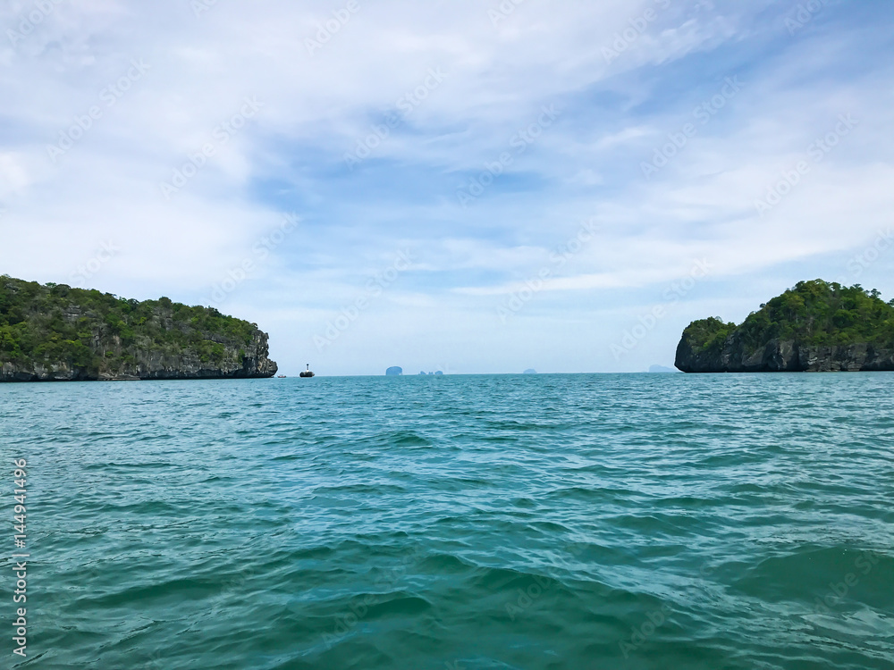 Island  under sun shine beautiful emerald sea and blue sky in summer of Andaman sea Trang province Thailand