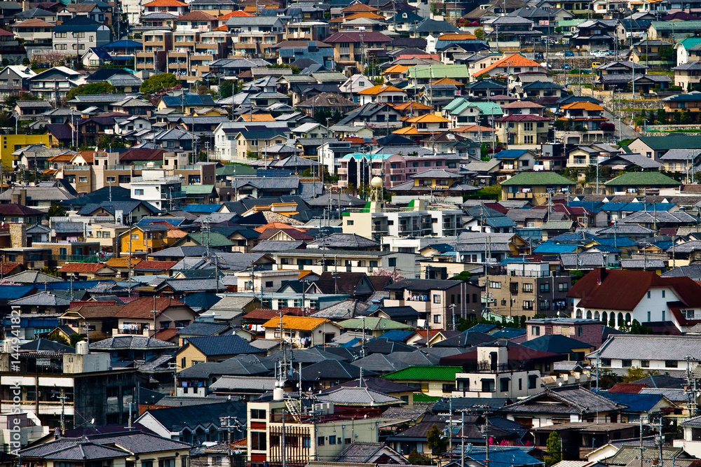 Aerial view over the rooftops of residential houses in Himeji, Japan.
