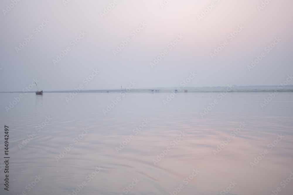 Misty dawn over the river Ganges, Varanasi.