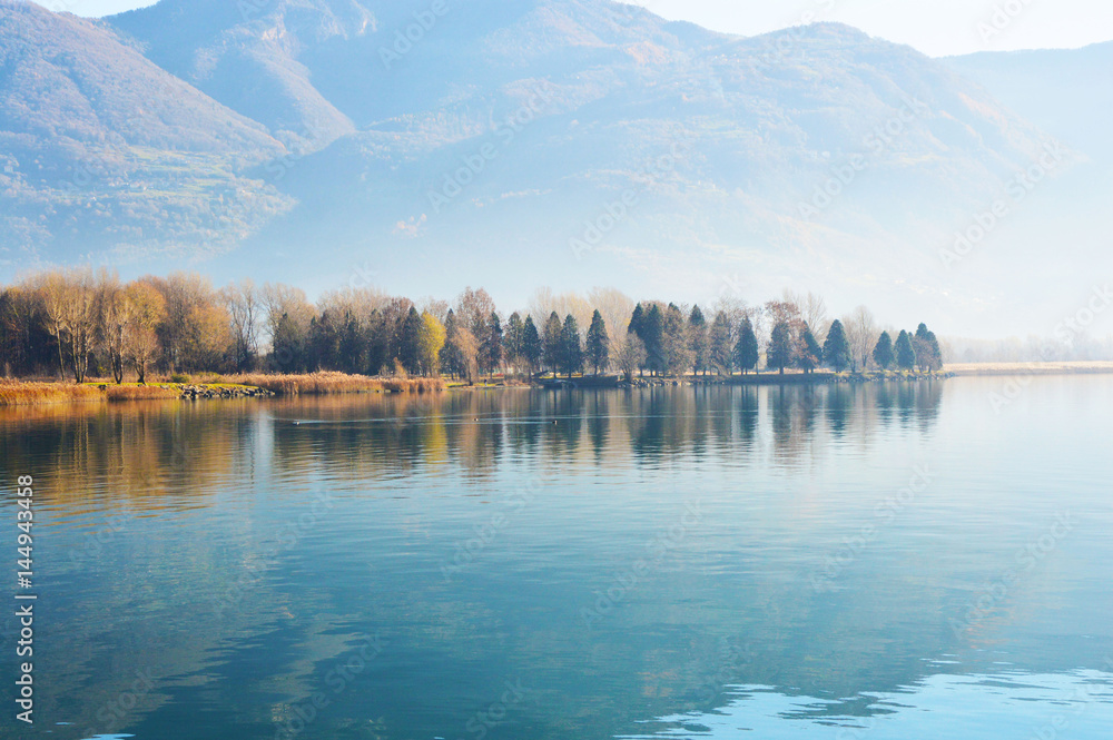 Fototapeta premium Beautiful landscape of Lake Iseo with forest and reflection in the water, Lovere, Italy 
