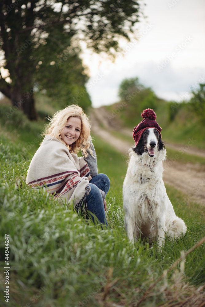 Fashionable young woman having fun with her dog Fashionable young woman having fun with her dog