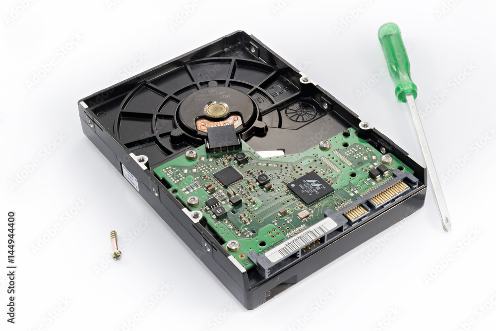 harddisk drive(HDD) with screw and screw driver isolated on white background, shallow depth of field, selective focus (detailed close-up shot) harddisk drive(HDD) with screw and screw driver isolated on white background, shallow depth of field, selective focus (detailed close-up shot)