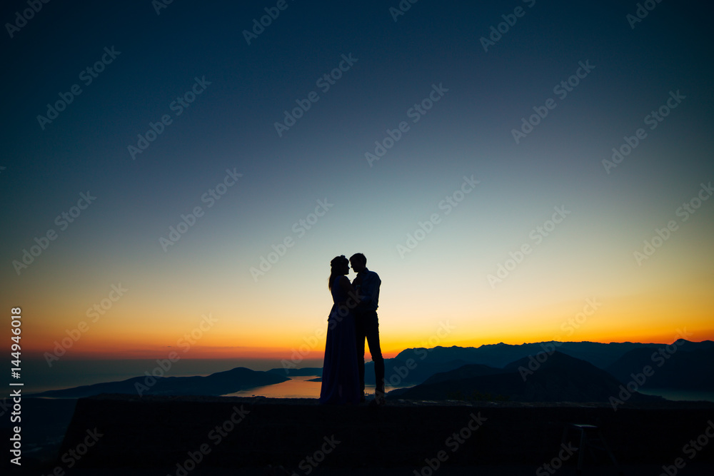 Silhouettes at sunset on Mount Lovcen in Montenegro