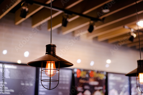 Light, design and interior. Vintage metallic lantern in cafe.
