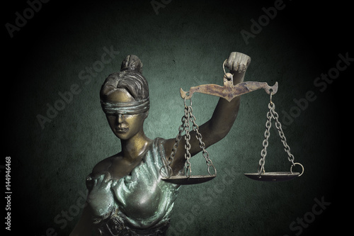 Lady Justice on grunge emerald background