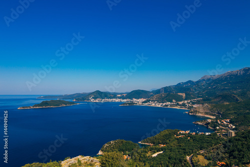 Fototapeta Naklejka Na Ścianę i Meble -  Panorama of the coastline of Budva Riviera from the mountain on a sunny day. Montenegro.