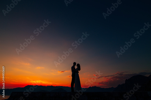 Silhouettes at sunset on Mount Lovcen in Montenegro © Nadtochiy