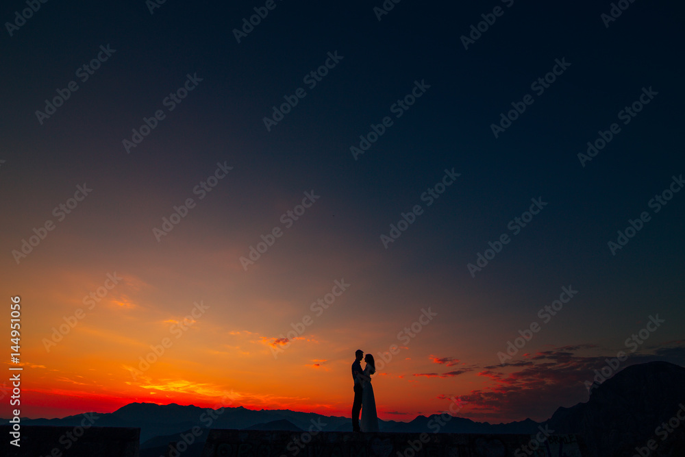 Silhouettes at sunset on Mount Lovcen in Montenegro