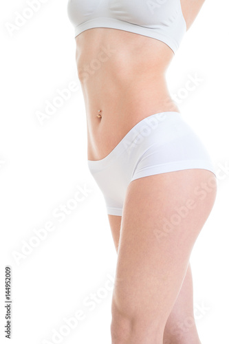 Beautiful woman model stomach on white background. Perfect body. Closeup.