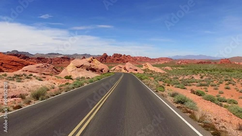 Incredibly beautiful landscape in Southern Nevada, Valley of Fire State Park, USA. Smooth camera movement along the road.