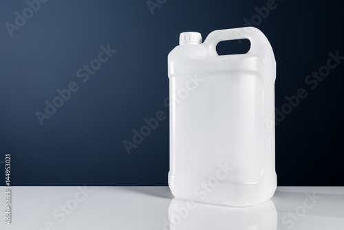 Unlabeled white plastic tank canister chemical liquid container