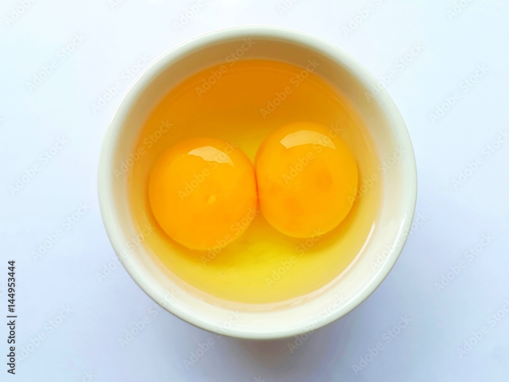 White bowl with eggs on white background. White bowl with eggs on white background.
