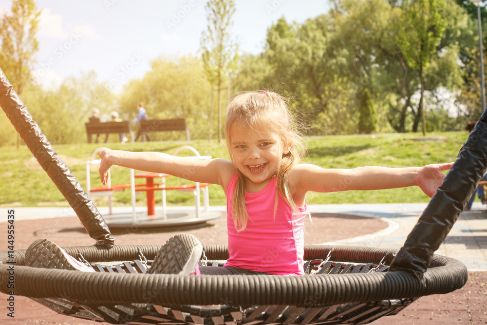 Blonde little girl on the swing. Blonde little girl on the swing.