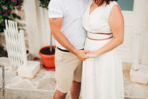 Bride and groom holding hands. Wedding in Montenegro