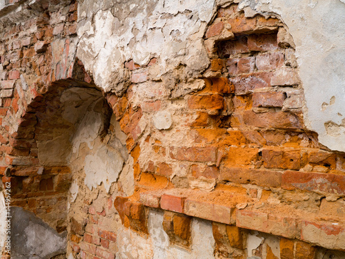 Ancient brick wall collapsing from antiquity photo