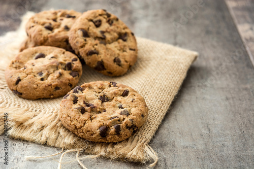 Chocolate chip cookies on wooden table background
