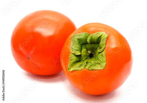 Two orange ripe persimmon isolated