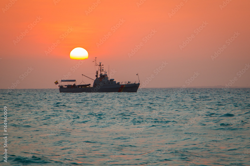 The see sunset at the coast of Cartagena town in Colombia