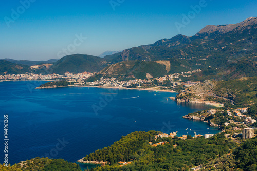 Panorama of the coastline of Budva Riviera from the mountain on a sunny day. Montenegro. © Nadtochiy