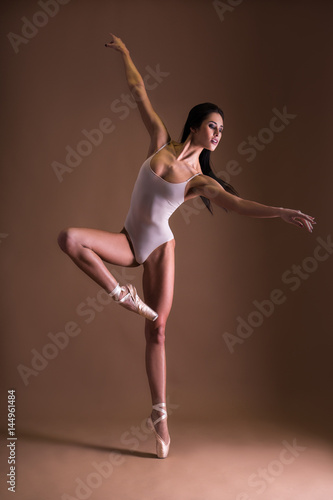Wallpaper Mural beautiful woman ballet dancer dancing over beige Torontodigital.ca