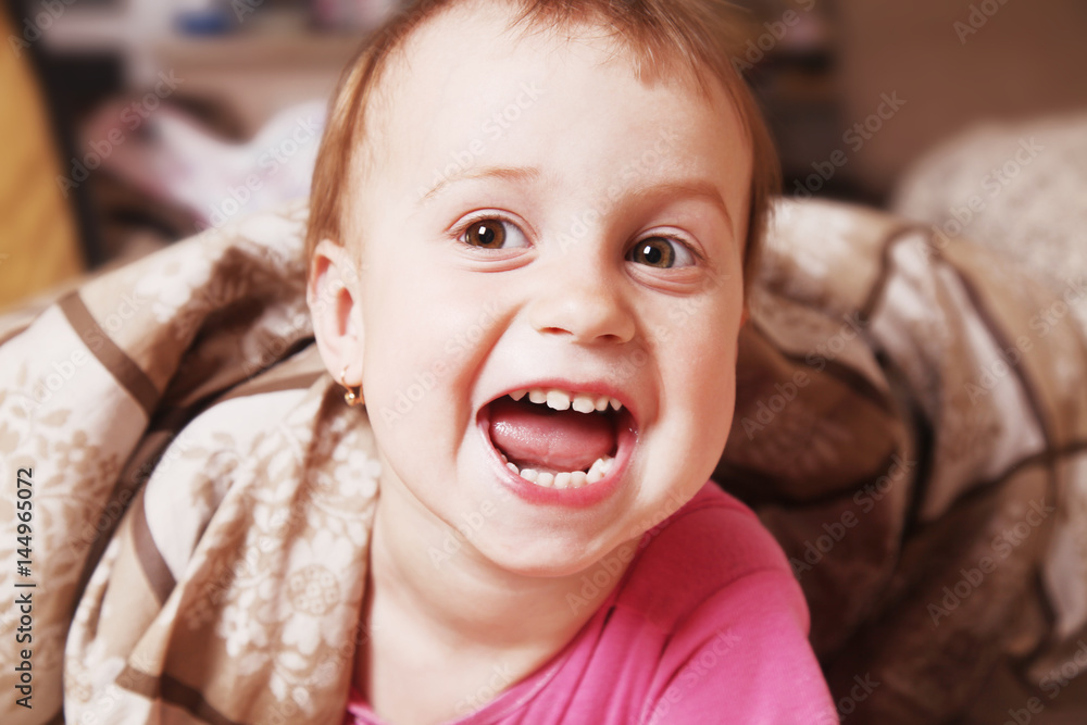 Happy funny baby girl before bedtime (Childhood, laughter, security, joy, reliability concept) Happy funny baby girl before bedtime (Childhood, laughter, security, joy, reliability concept)