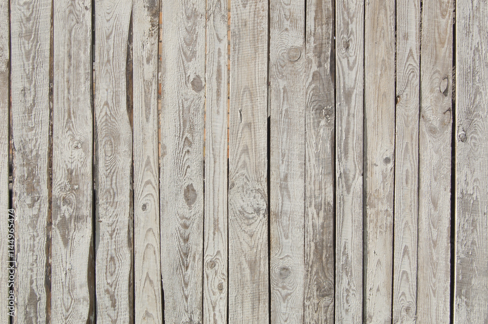 white old wooden fence. wood palisade background. planks texture, weathered surface white old wooden fence. wood palisade background. planks texture, weathered surface