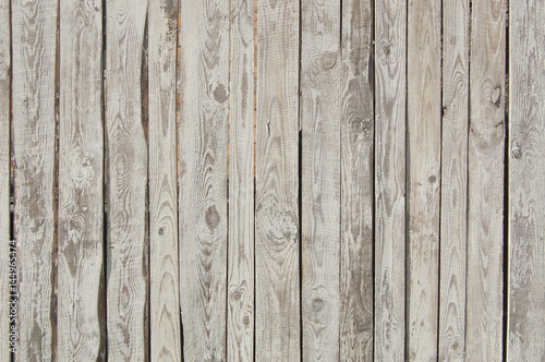 white old wooden fence. wood palisade background. planks texture  weathered surface